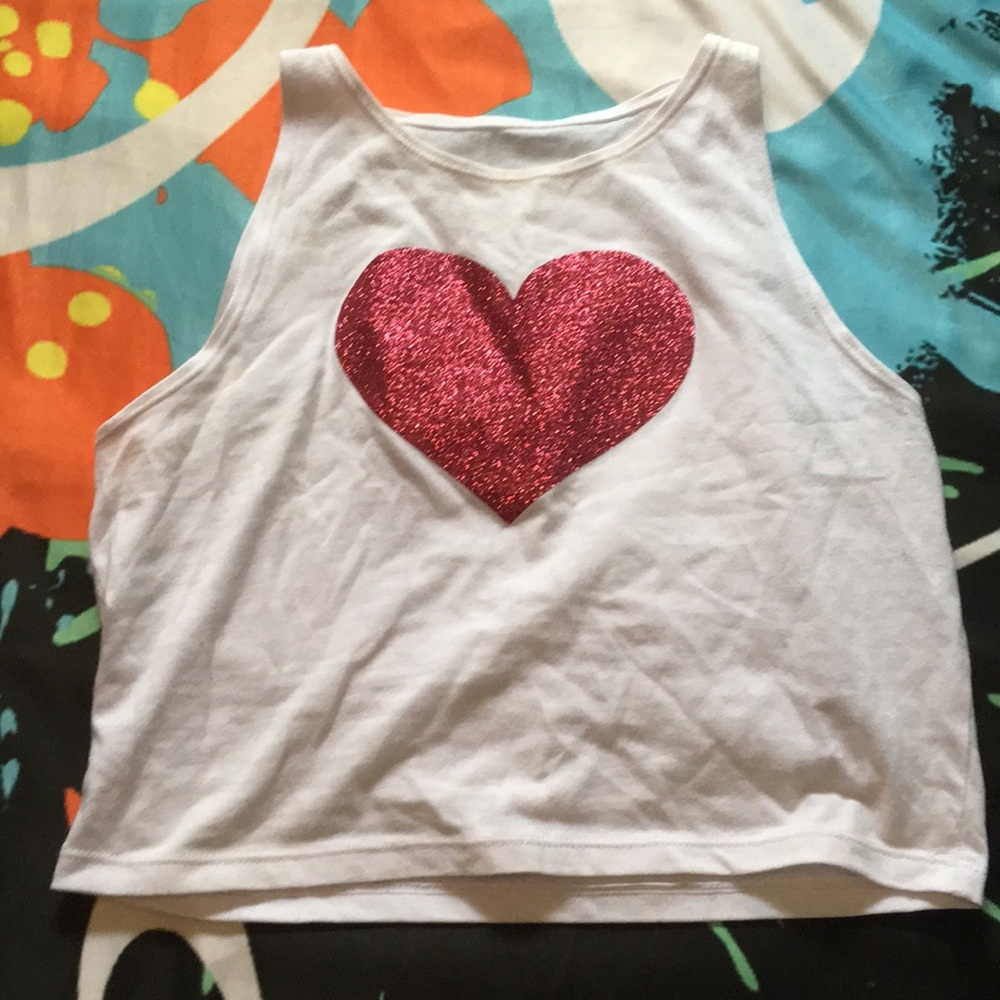 Crop top with a pink glittery heart in the middle